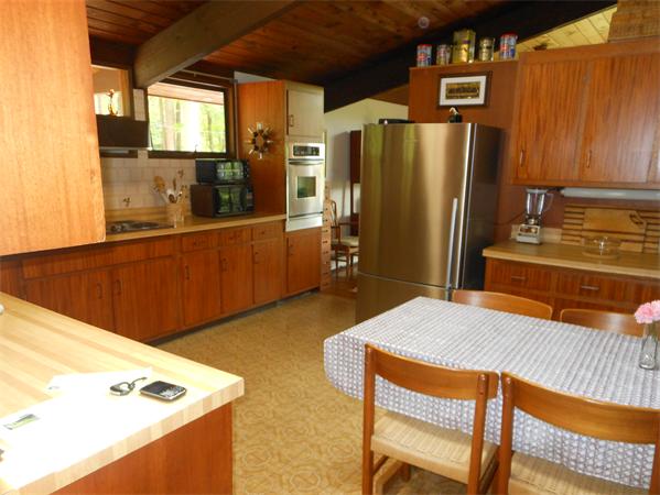 30 Sedgemeadow Road Wayland, MA 01778 - Photo 11 of 30 a kitchen with stainless steel appliances granite countertop a refrigerator a stove and a sink with wooden cabinets