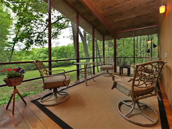 30 Sedgemeadow Road Wayland, MA 01778 - Photo 12 of 30 a living room with patio furniture and a garden