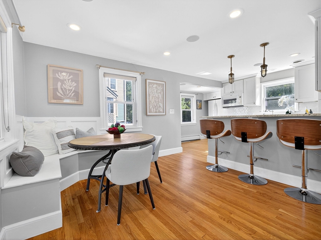 170 Payson Road Boston, MA 02467 - Photo 11 of 20 a view of a dining room with furniture and wooden floor