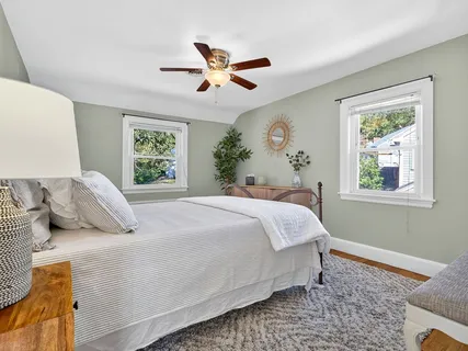 a bedroom with a large bed and a window