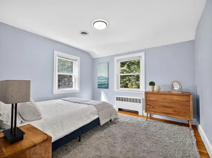 a bed room with a bed and a lamp