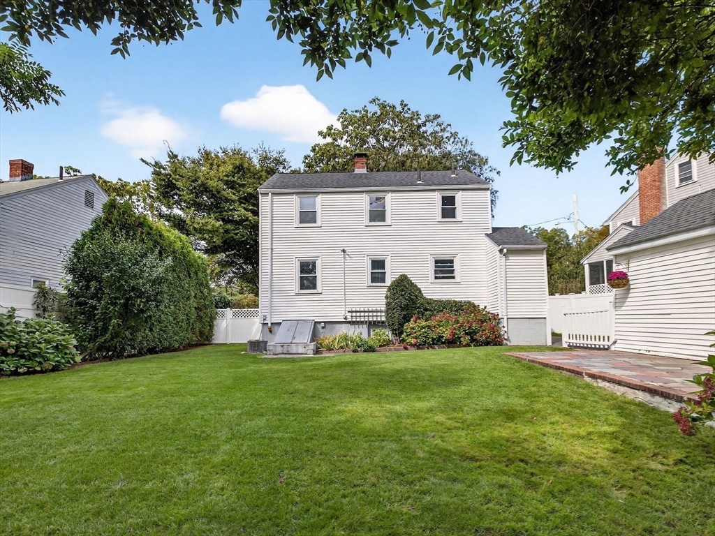 170 Payson Road Boston, MA 02467 - Photo 19 of 20 a view of a house with a yard