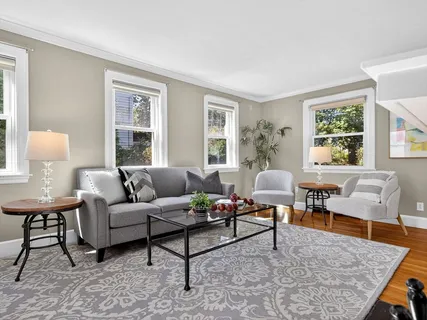 a living room with furniture and a table