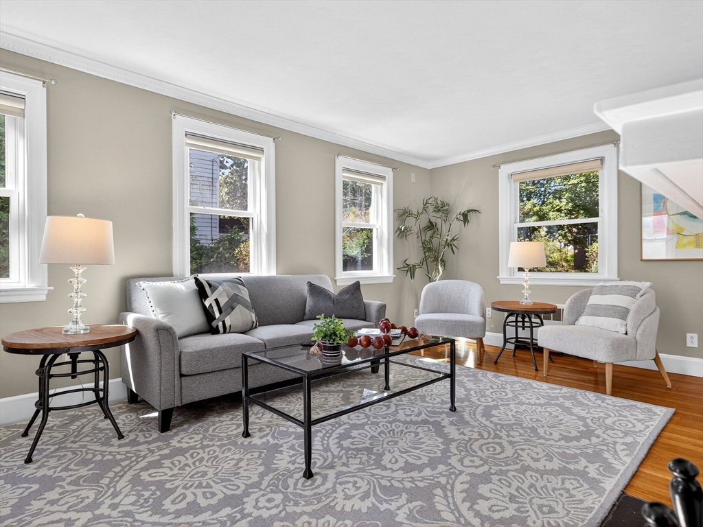 170 Payson Road Boston, MA 02467 - Photo 5 of 20 a living room with furniture and a table