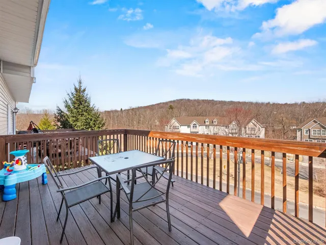 a view of a chairs on the roof deck