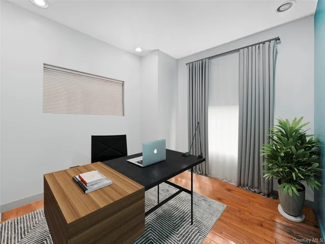 a workspace with furniture and wooden floor