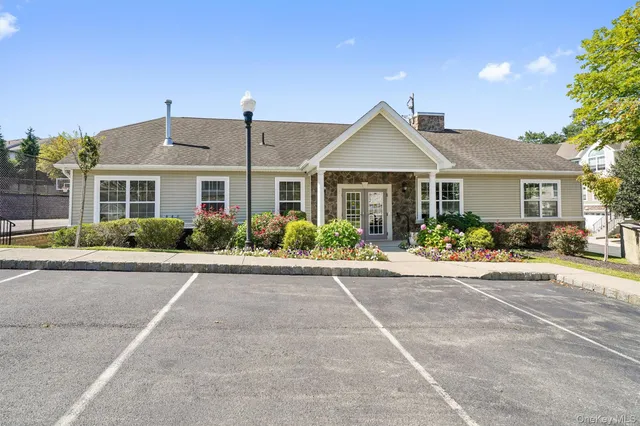 a front view of a house with yard