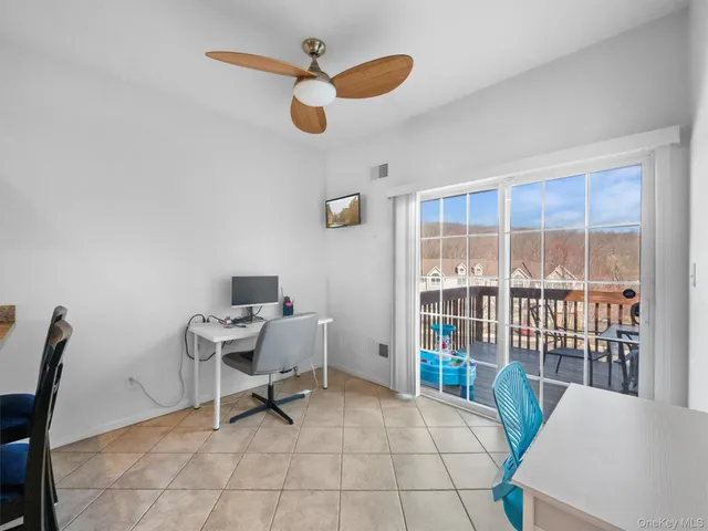 a workspace with furniture and a window