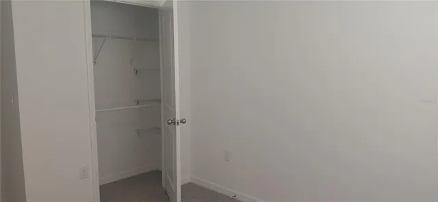 a living room with furniture and large windows