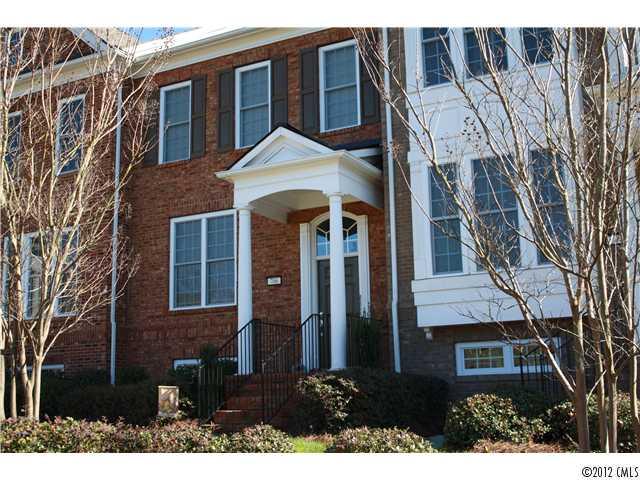 706 Passage Drive, Unit 31 Fort Mill, SC 29708 - Photo 2 of 16 a view of a brick house with many windows