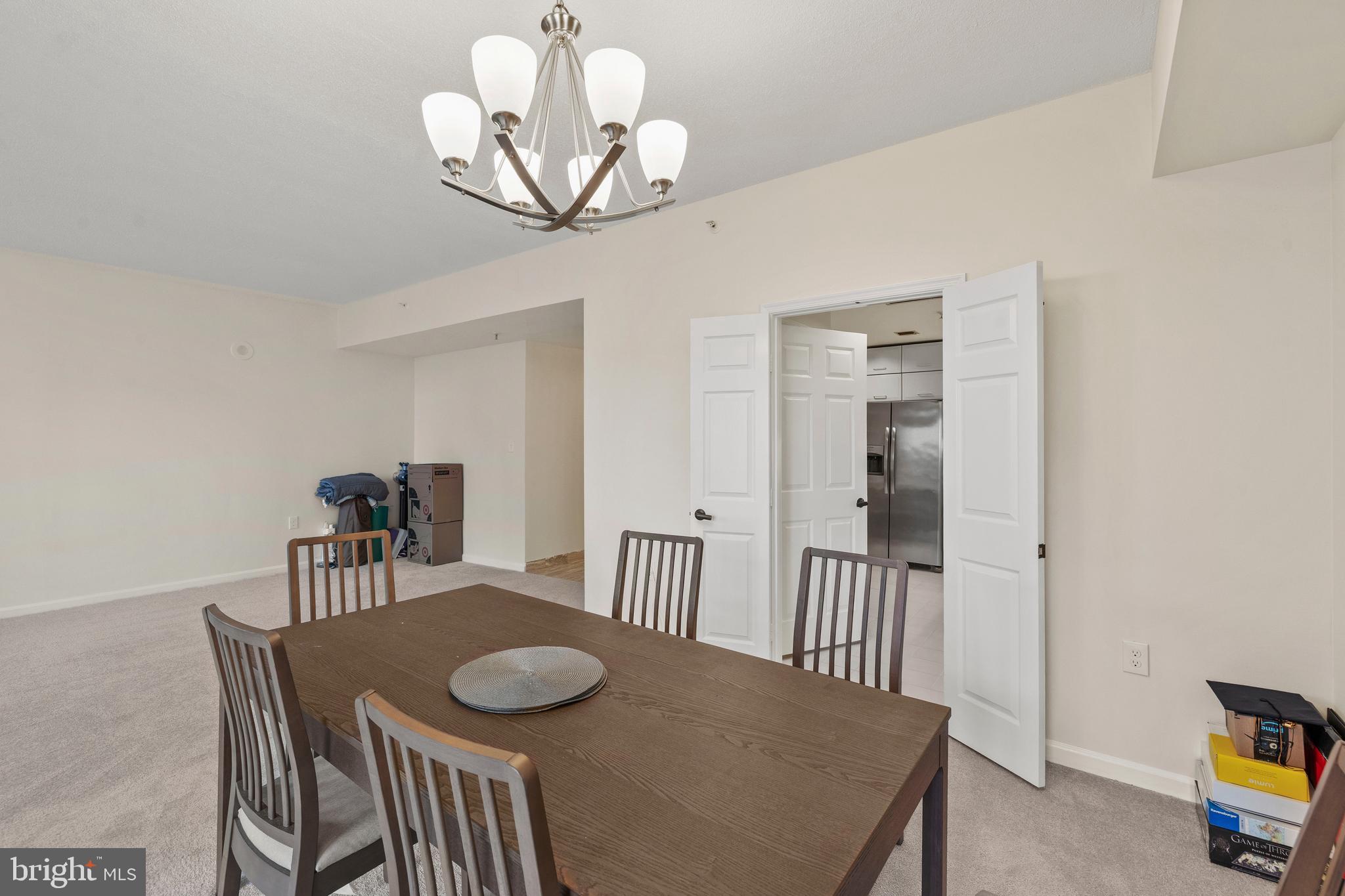 3801 Canterbury Road, Unit 708 Baltimore, MD 21218 - Photo 12 of 22 a view of a dining room with furniture