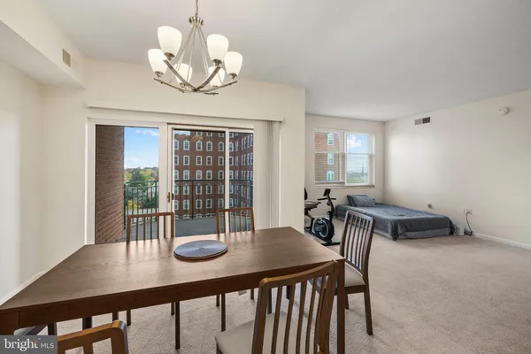 a kitchen with a sink a stove and cabinets