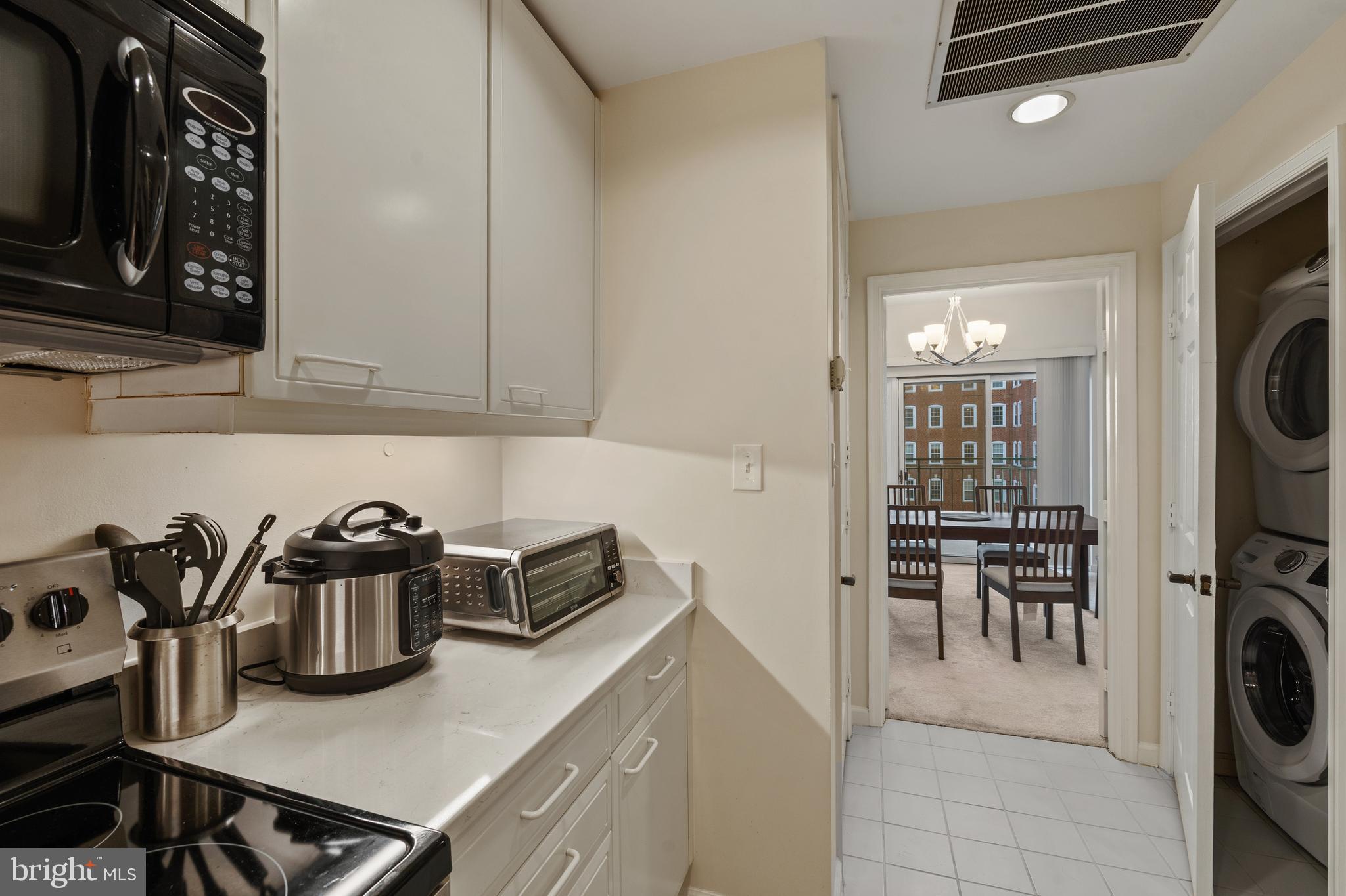 3801 Canterbury Road, Unit 708 Baltimore, MD 21218 - Photo 15 of 22 a kitchen with a sink a stove and cabinets