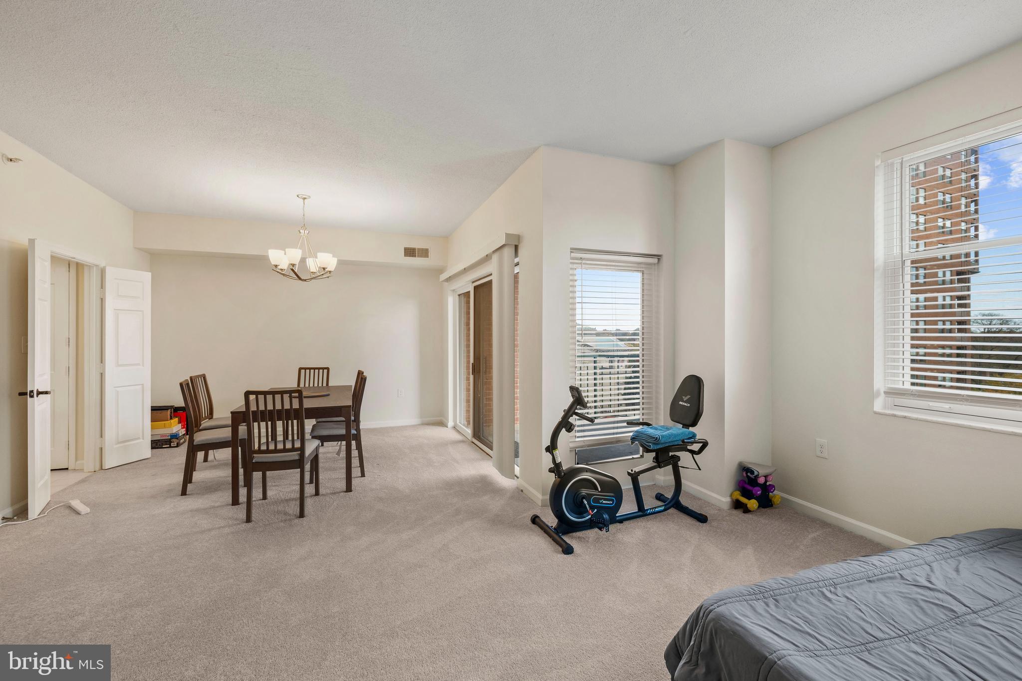 3801 Canterbury Road, Unit 708 Baltimore, MD 21218 - Photo 9 of 22 a living room with furniture and a window