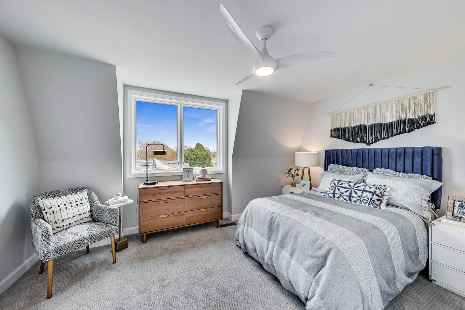 1261 Shermer Road Northbrook, IL 60062 - Photo 20 of 33 a bedroom with a bed and a couch