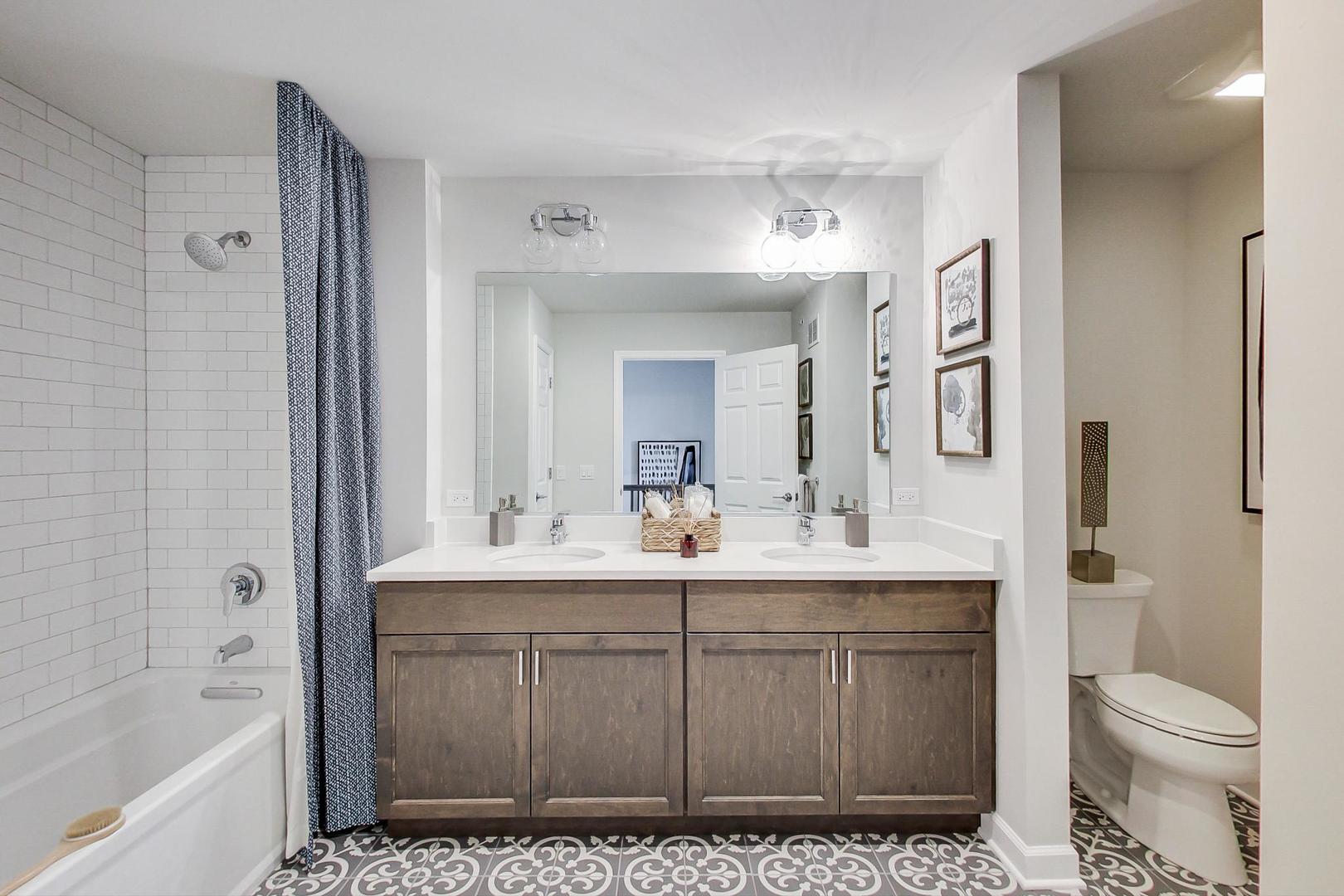 1261 Shermer Road Northbrook, IL 60062 - Photo 22 of 33 a bathroom with a sink a toilet and shower