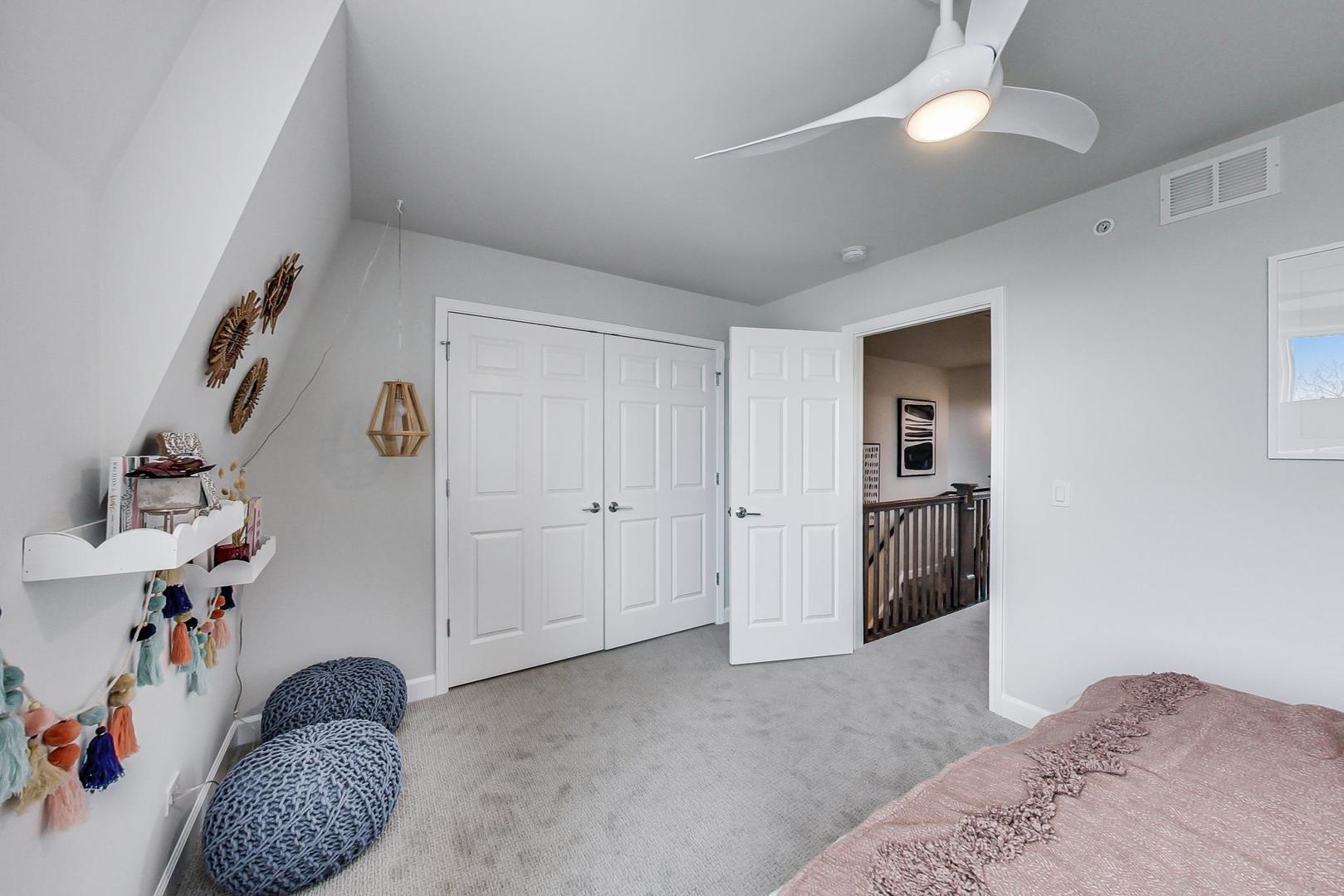 1261 Shermer Road Northbrook, IL 60062 - Photo 25 of 33 a bedroom with a bed and a book shelf