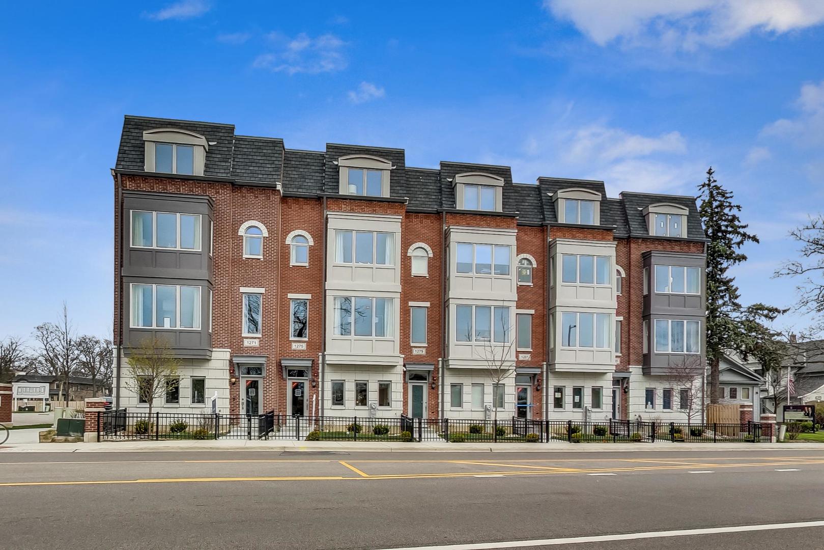 1261 Shermer Road Northbrook, IL 60062 - Photo 27 of 33 a front view of a building with lot of cars and trees