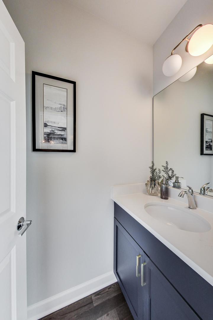 1261 Shermer Road Northbrook, IL 60062 - Photo 5 of 33 a bathroom with a sink and a mirror