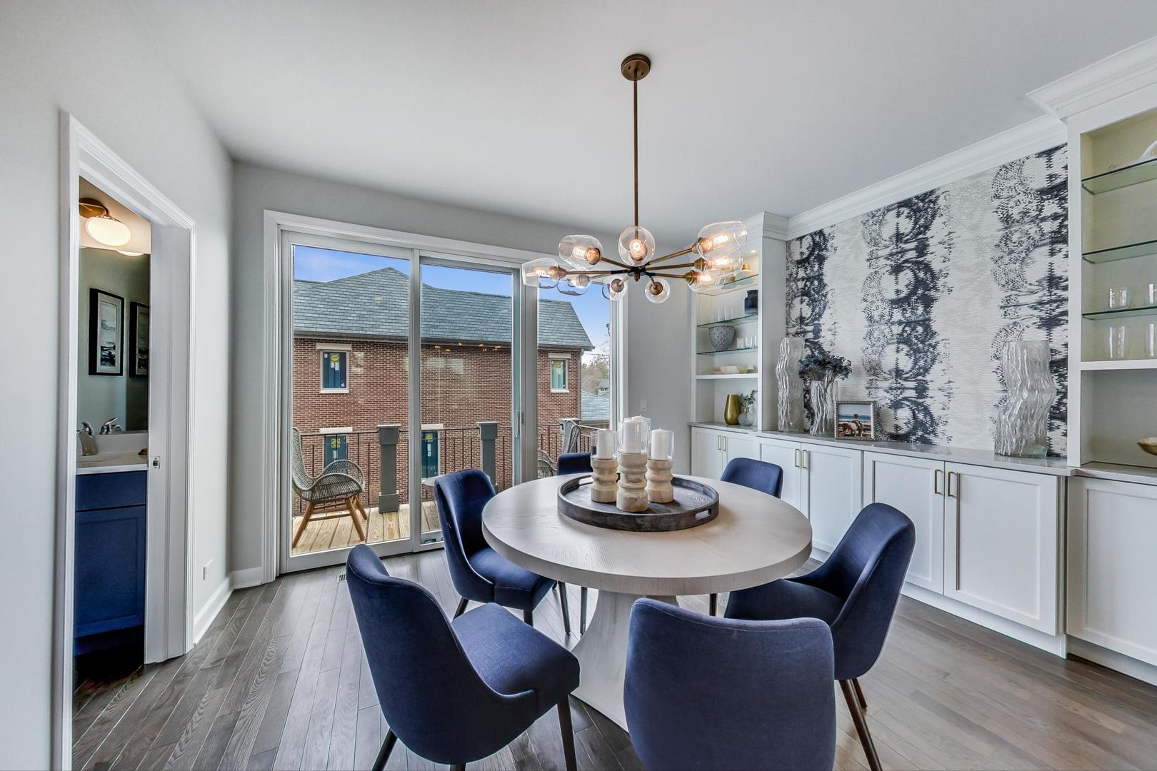 1261 Shermer Road Northbrook, IL 60062 - Photo 6 of 33 a dining room with furniture a chandelier and wooden floor