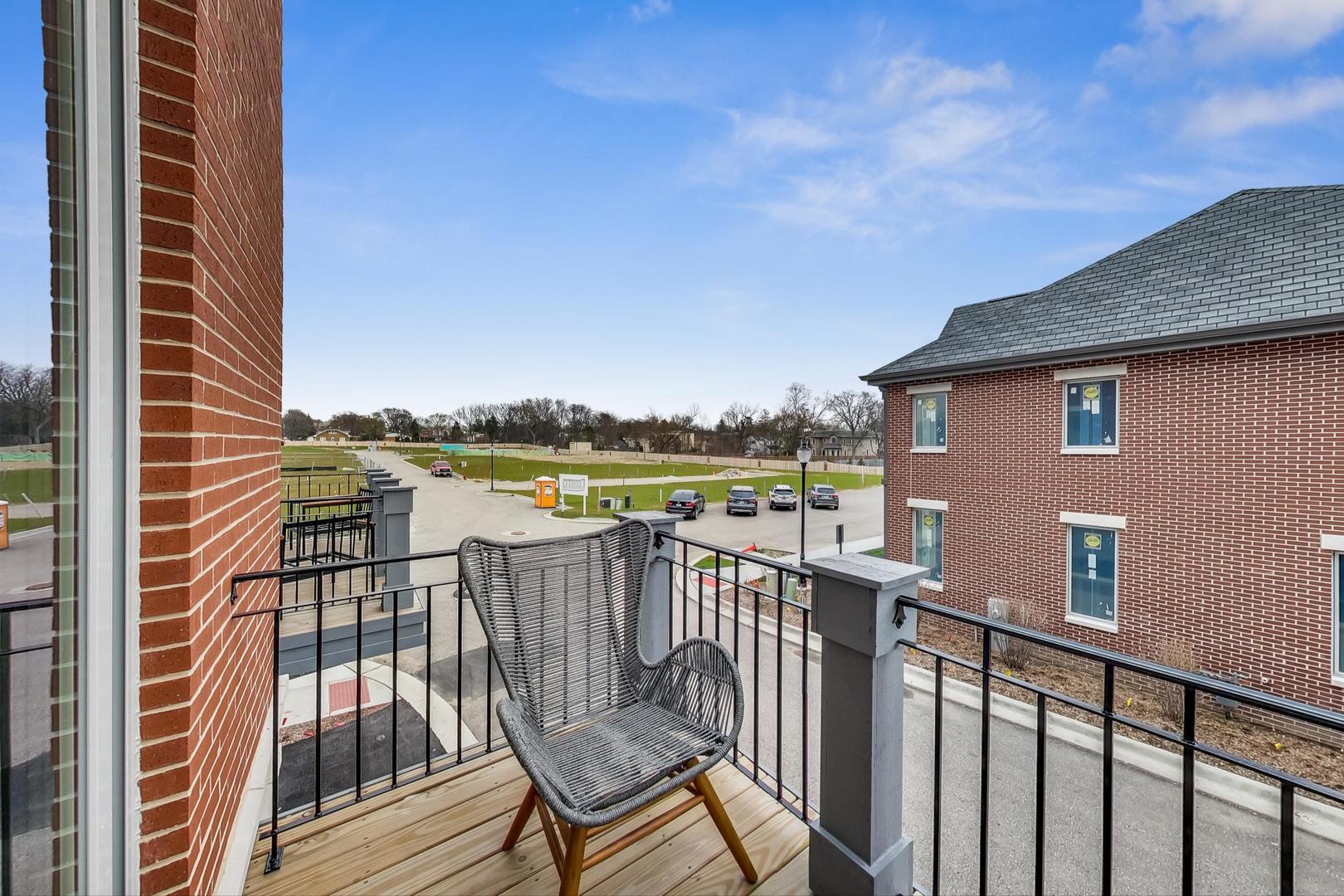 1261 Shermer Road Northbrook, IL 60062 - Photo 7 of 33 a view of a balcony with wooden floor and fence