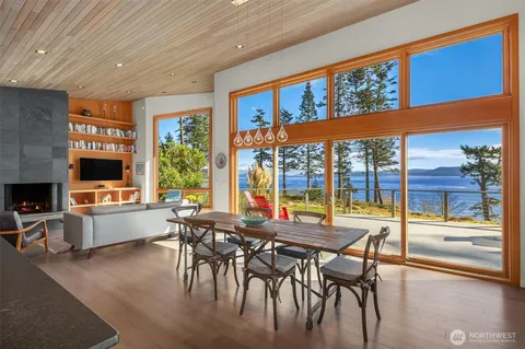 a view of a dining room with furniture window and outside view