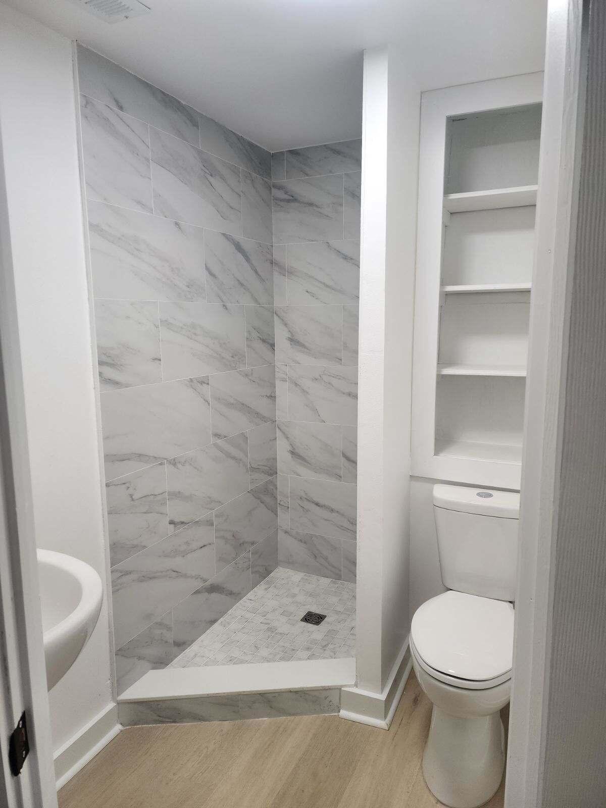 1853 Wadsworth Road Baker, FL 32531 - Photo 4 of 5 a bathroom with a toilet and a shower