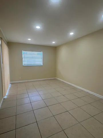 an empty room with a empty space and window