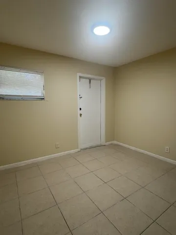 an empty room with a bench