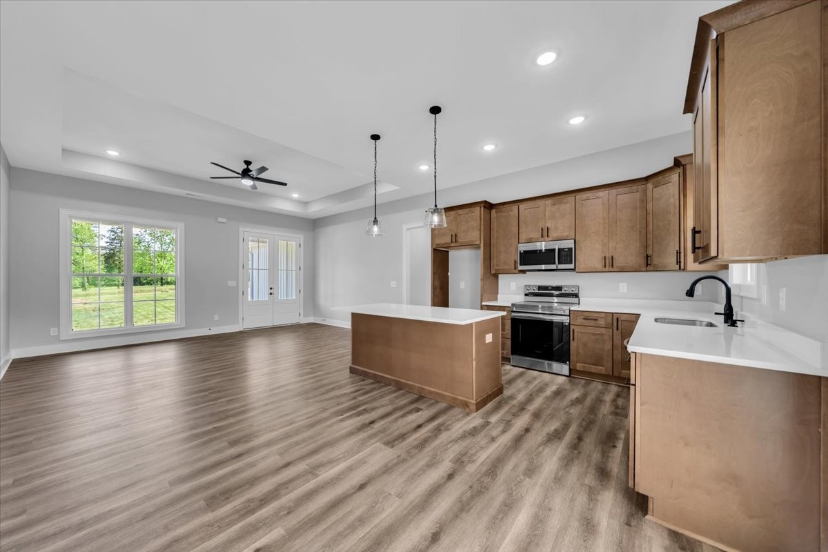 749 Edd Ramsey Road McMinnville, TN 37110 - Photo 11 of 40 a large kitchen with kitchen island a sink stainless steel appliances and cabinets