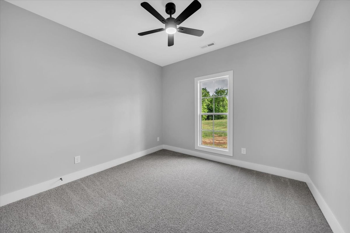749 Edd Ramsey Road McMinnville, TN 37110 - Photo 18 of 40 an empty room with a window and a fan