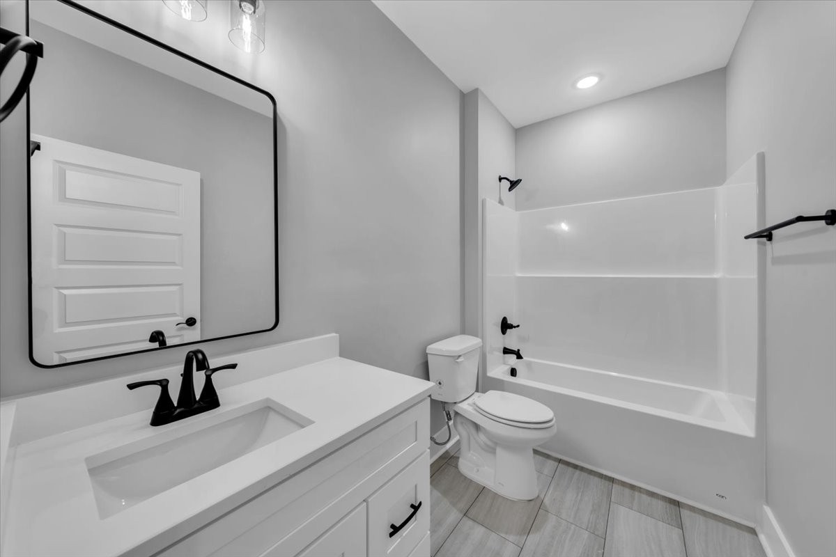 749 Edd Ramsey Road McMinnville, TN 37110 - Photo 20 of 40 a bathroom with a sink a toilet and shower