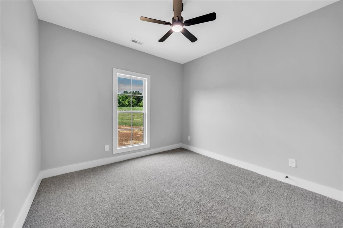 749 Edd Ramsey Road McMinnville, TN 37110 - Photo 21 of 40 an empty room with a window and a fan