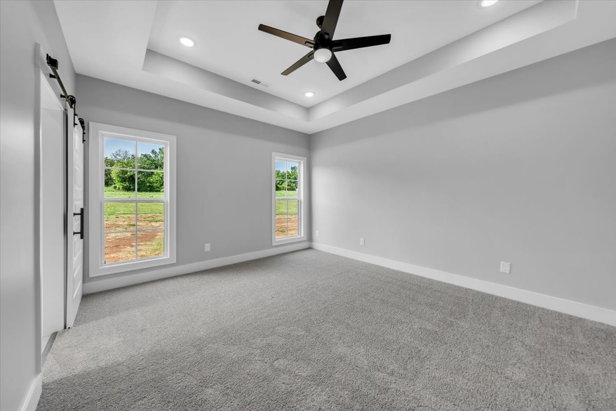 749 Edd Ramsey Road McMinnville, TN 37110 - Photo 28 of 40 an empty room with windows and ceiling fan