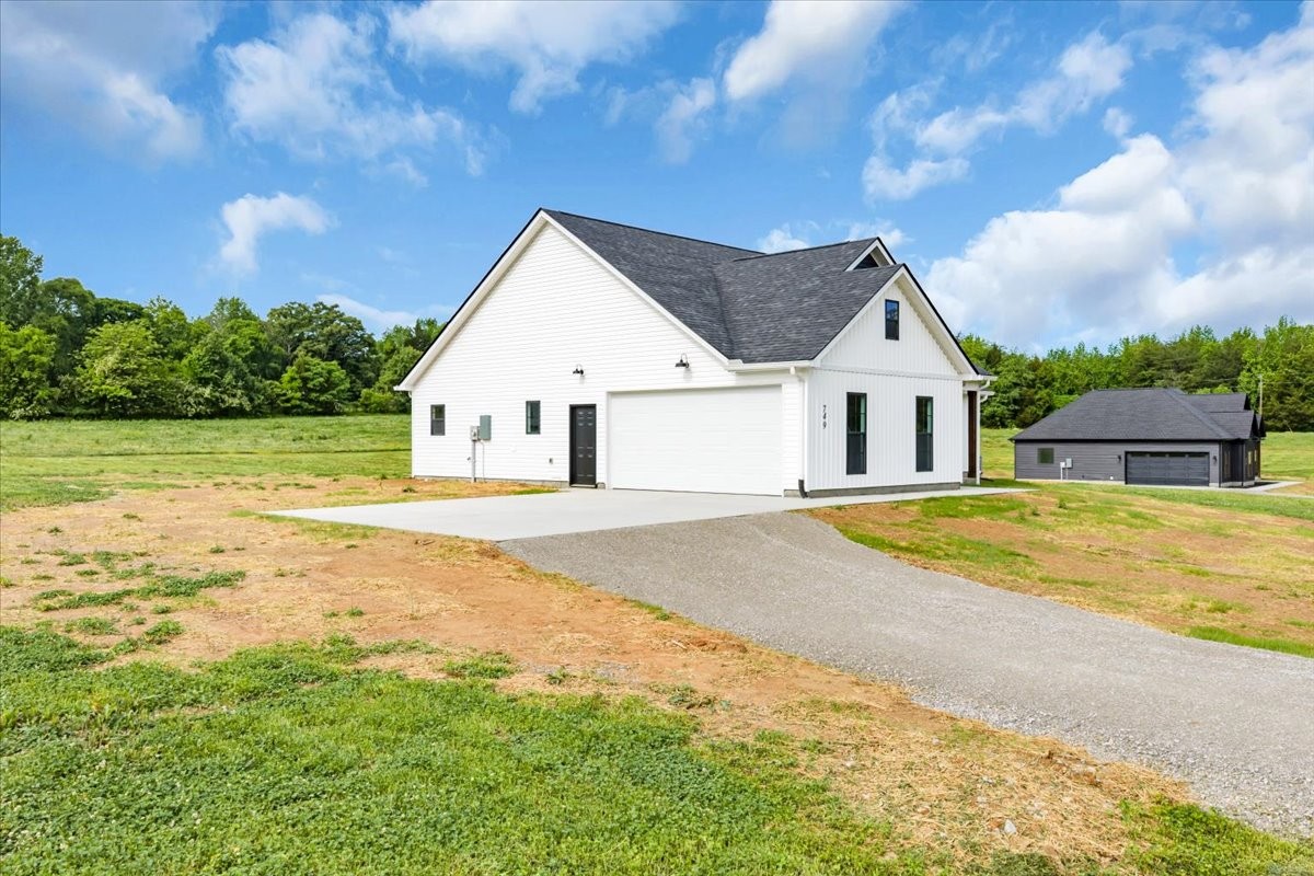 749 Edd Ramsey Road McMinnville, TN 37110 - Photo 35 of 40 a house with swimming pool in front of it