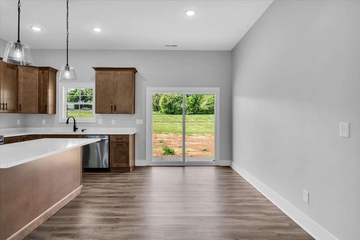 749 Edd Ramsey Road McMinnville, TN 37110 - Photo 9 of 40 a large kitchen with granite countertop a large counter top space a sink appliances and cabinets