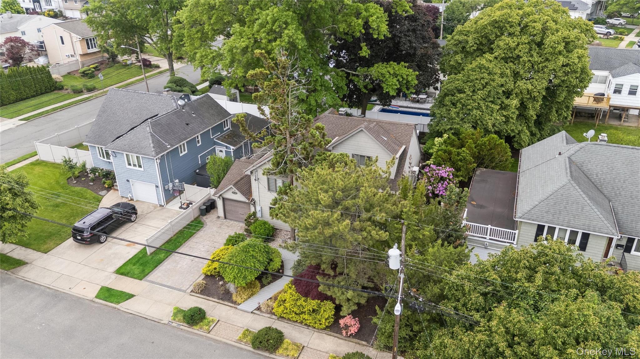 2772 Riverside Avenue Merrick, NY 11566 - Photo 32 of 45 an aerial view of multiple houses with yard