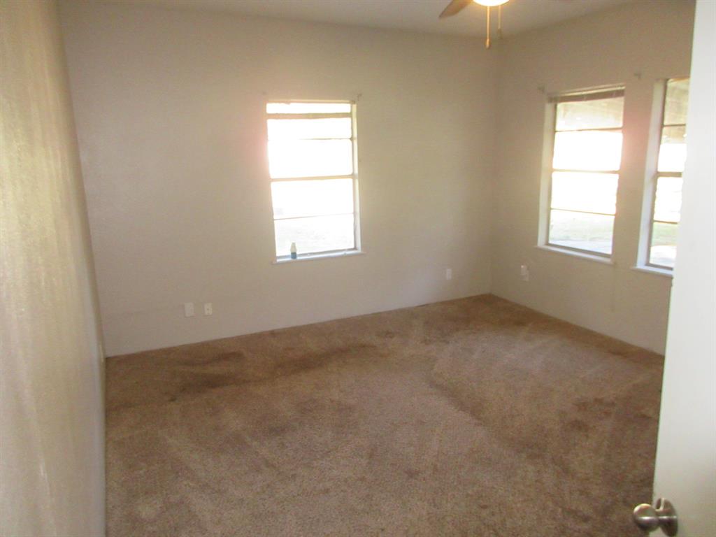 1021 Scarpengo Road Shreveport, LA 71107 - Photo 11 of 22 an empty room with a window
