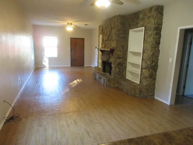 a view of a livingroom with wooden floor