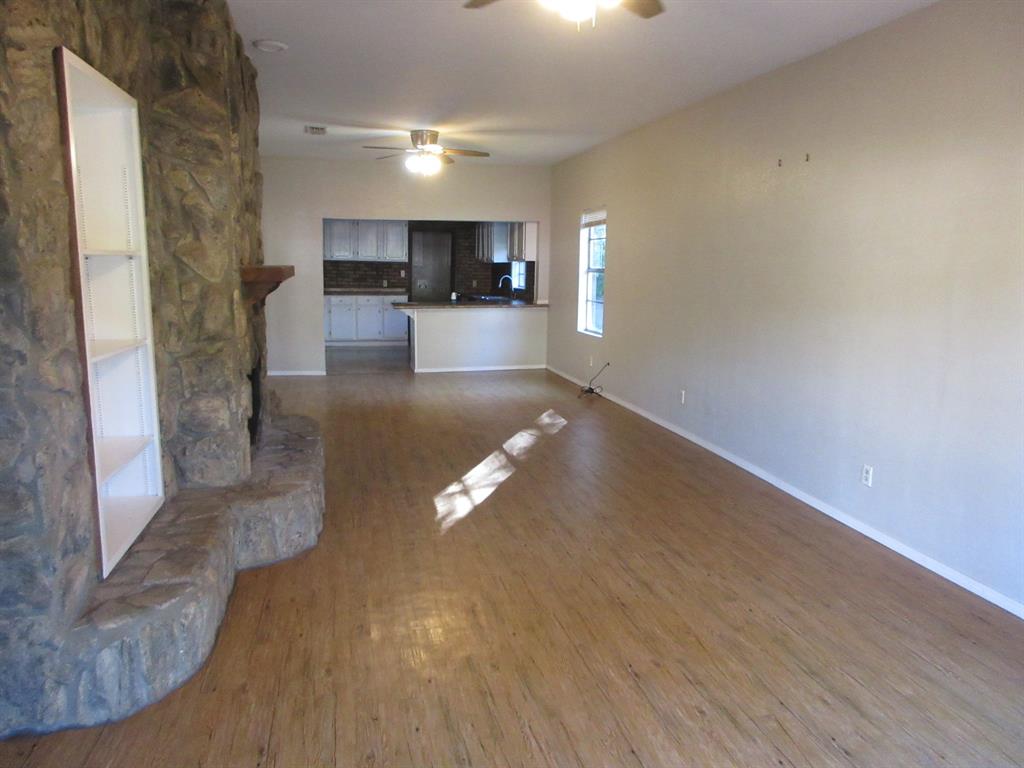 1021 Scarpengo Road Shreveport, LA 71107 - Photo 4 of 22 a view of a living room with a wooden floor