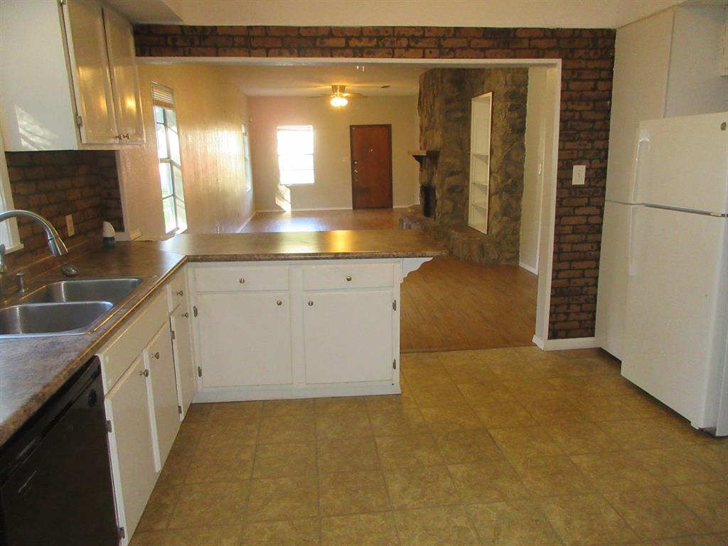 1021 Scarpengo Road Shreveport, LA 71107 - Photo 7 of 22 a bathroom with a double vanity sink a mirror and a shower
