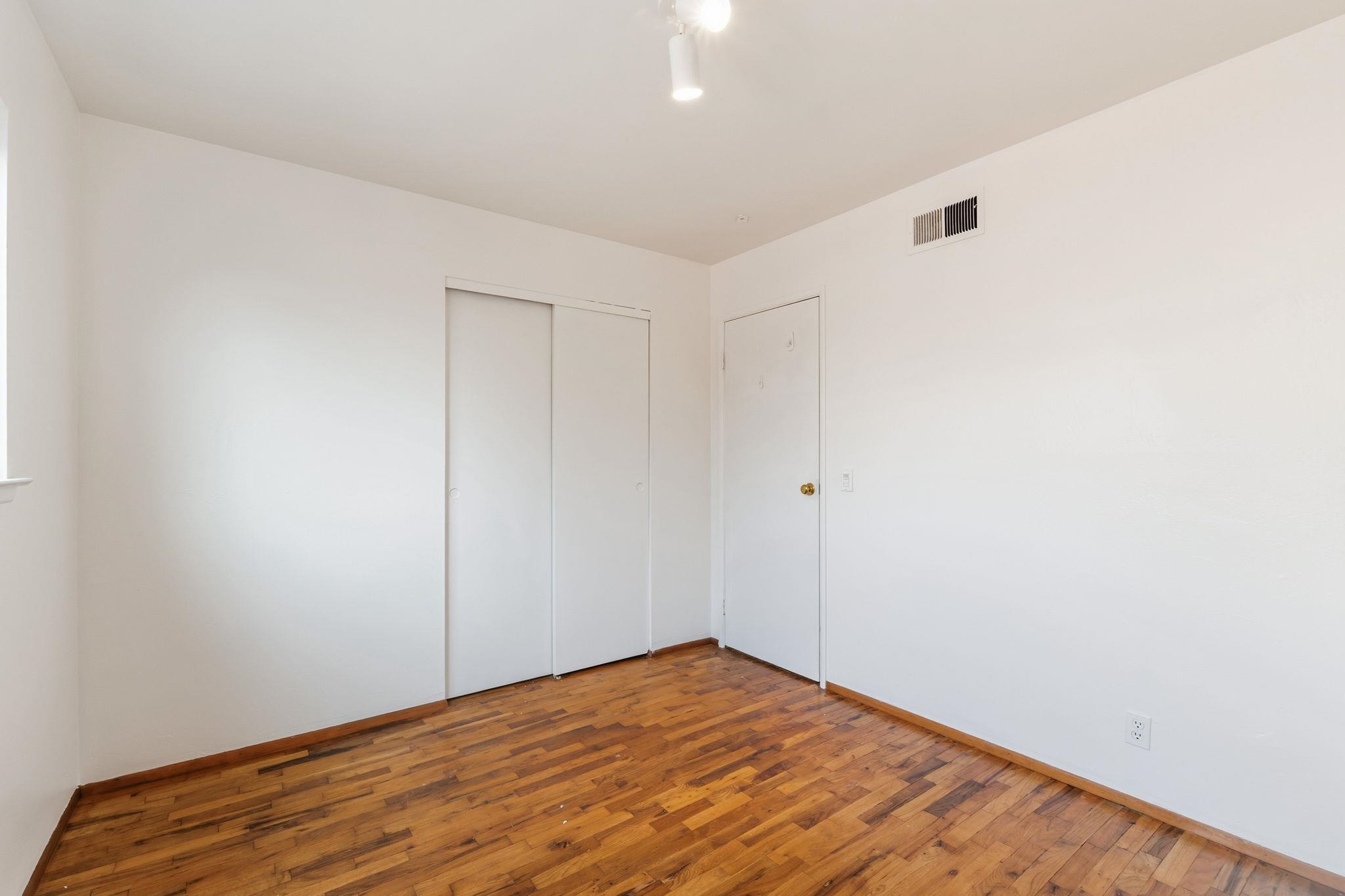 1609 Darwin Street Seaside, CA 93955 - Photo 20 of 26 Unfurnished bedroom with wood finished floors and a closet