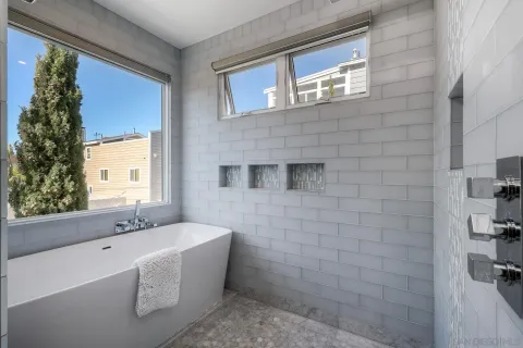 a bathroom with a bathtub and a sink