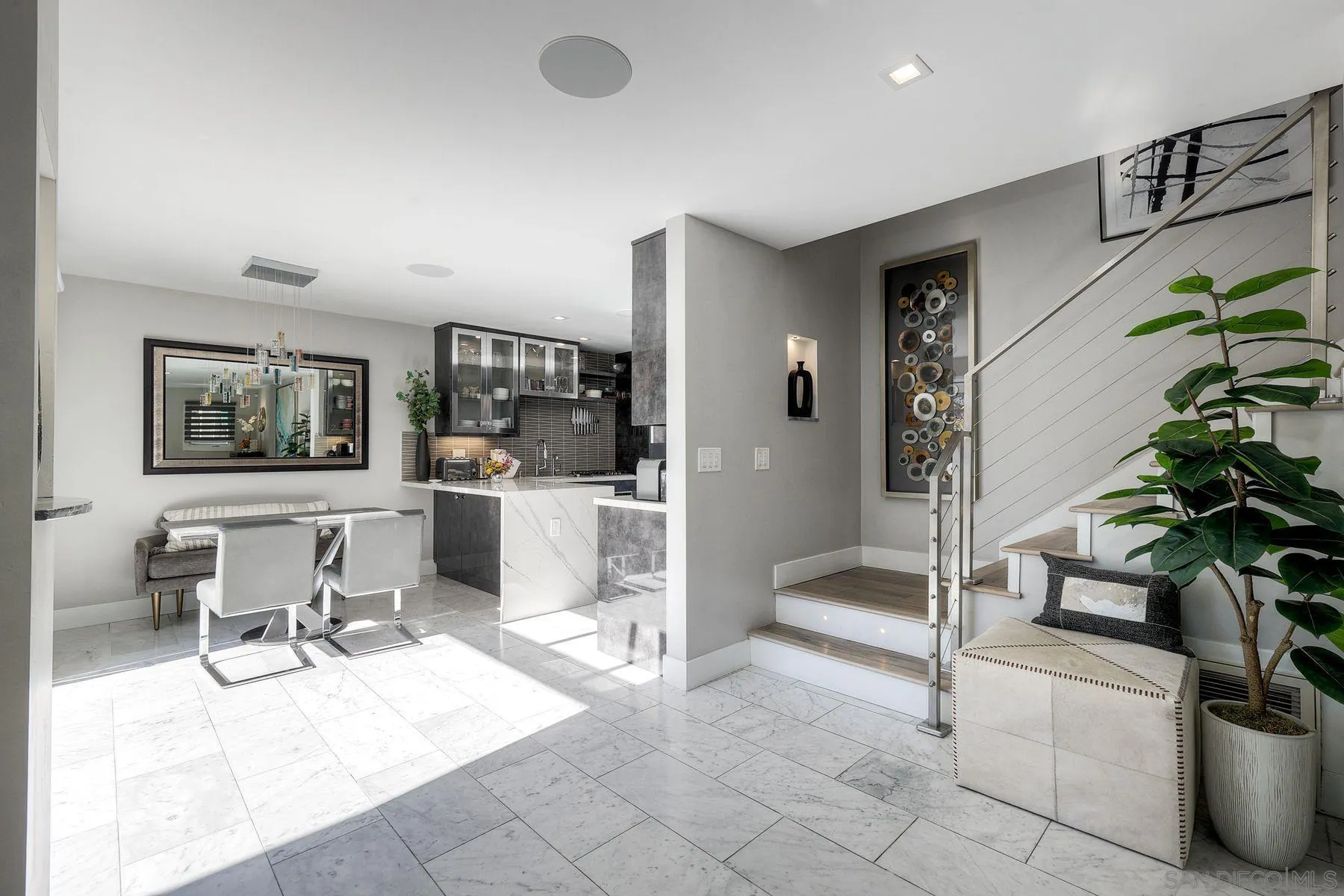 911 9th Street Coronado, CA 92118 - Photo 5 of 35 a living room with furniture a potted plant and a table