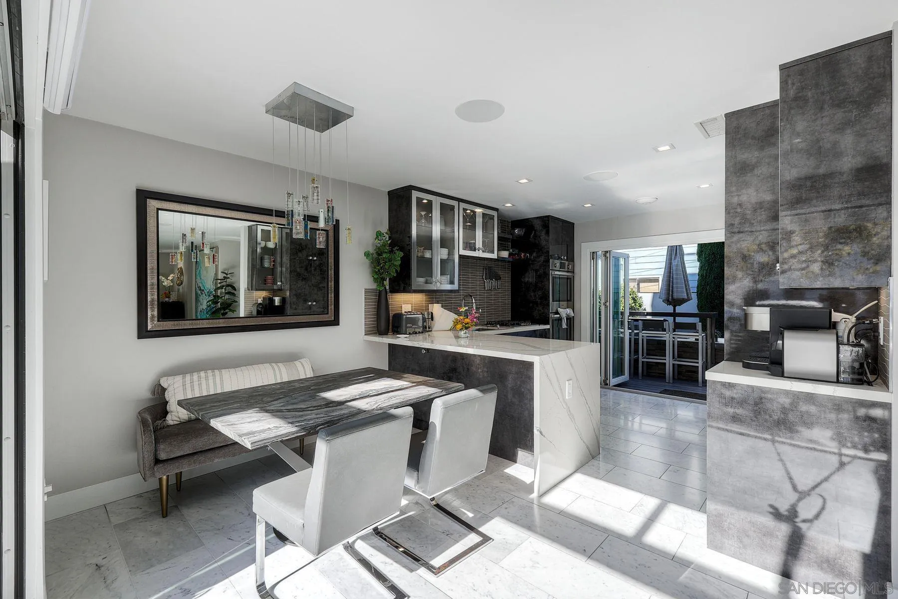 911 9th Street Coronado, CA 92118 - Photo 6 of 35 a living room with fireplace furniture and a flat screen tv