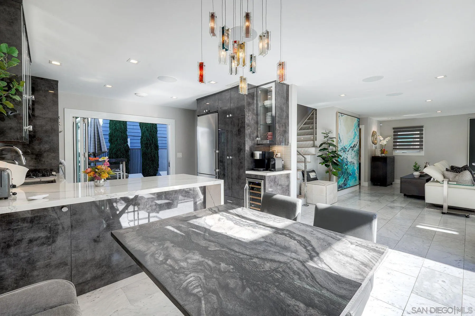 911 9th Street Coronado, CA 92118 - Photo 7 of 35 a bedroom with a large bed a potted plant and a large window