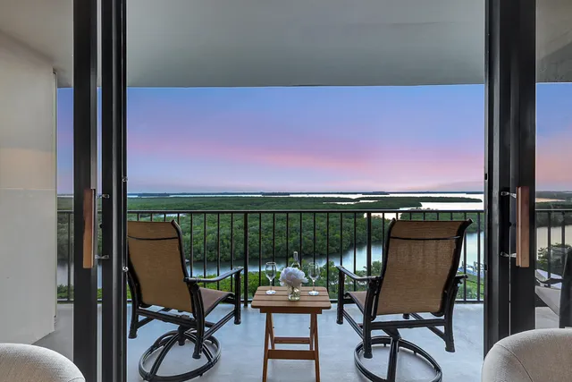 a view of a chairs and table in patio