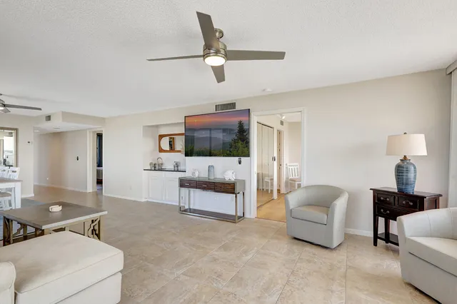 a bedroom with a bed and a view of balcony