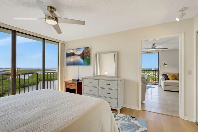 a bedroom with a bed and a lamp on table