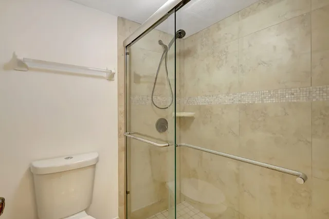a view of a bedroom with washer and dryer